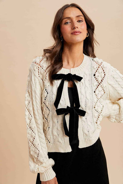 CABLE KNIT CARDIGAN WITH RIBBON TIE